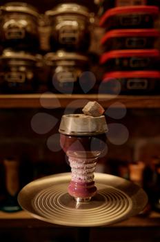 Hookah bowl with tobacco and coal closeup, nobody. Shisha bar equipment, traditional smoke culture, aroma for relaxation