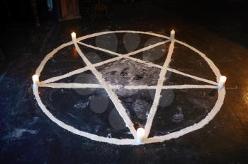 Magic circle with burning candles, nobody, demons casting out. Exorcism concept, mystery paranormal ritual, dark religion, night horror