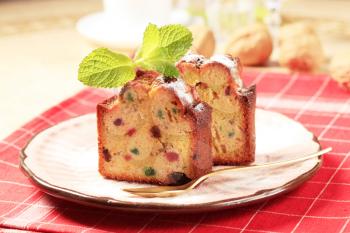 Two pieces of fruit cake on plate