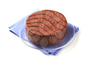 Delicious cake glazed with chocolate icing