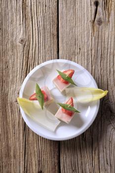 Ham and cheese canapes and endive - overhead