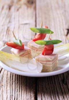 Ham and cheese canapes and fresh endive