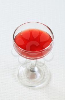 Red juice in a wine glass