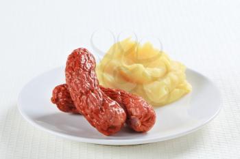 Dish of mashed potato and sausages 