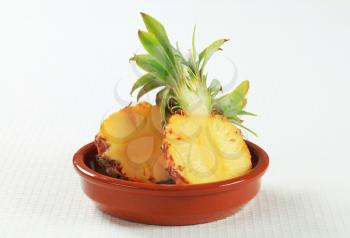 Fresh pineapple cut into halves