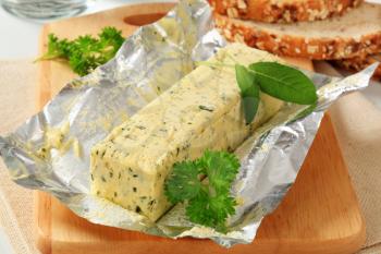Stick of fresh herb butter and bread