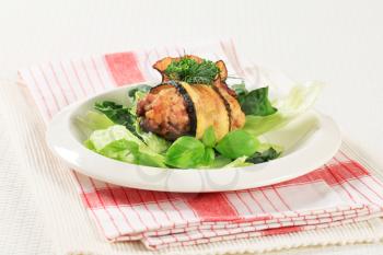 Meatball wrapped in courgette on nest of lettuce leaves