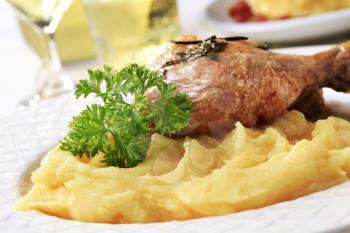 Cooked chicken leg with potato puree