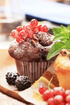 Tasty muffins garnished with berry fruit