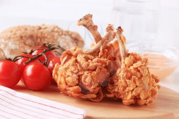 Chicken drumsticks coated with crunchy corn flakes