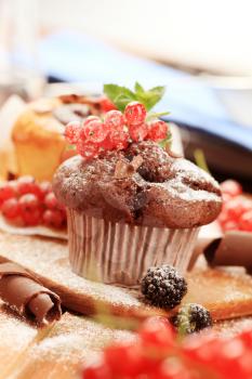 Chocolate muffin and fresh berry fruit - still