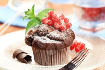 Chocolate muffin dusted with icing sugar - detail