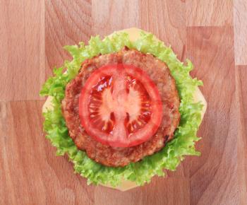 Overhead view of a cheeseburger - closeup