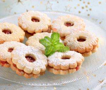Jam biscuits dusted with icing sugar - closeup