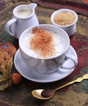 Cup of milk streamer with nutmeg and  brown sugar