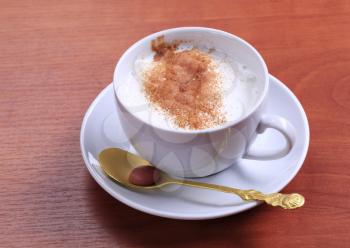 Vanilla steamer with a dusting of nutmeg or cinnamon