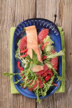 Salmon fillet on a nest of fresh salad