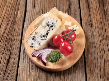 Blue cheese and feta on cutting board