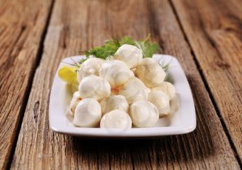 Mozzarella cheese balls on a platter
