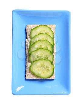 Crisp bread with slices of fresh cucumber