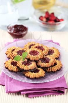 Chocolate dipped butter cookies with jam centers