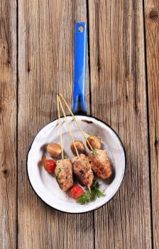Minced meat kebabs on sticks - overhead