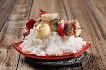 Chicken shish kebab on bed of white rice