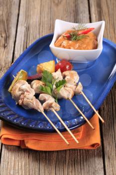 Chicken skewers and vegetable dipping sauce