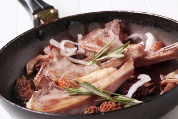 Roast lamb chops and mushrooms on a pan