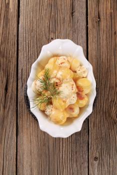 Dish of fried potato balls with mozzarella cheese
