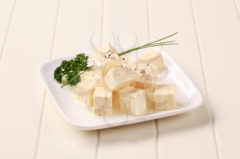 Diced feta cheese marinated in olive oil
