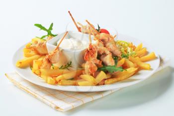 Chicken satay with French fries and tartar sauce