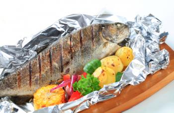 Grilled trout on aluminum foil