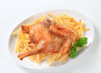 Crispy skin roast chicken with French fries