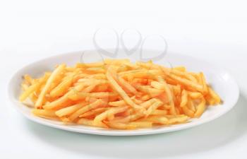 Fresh fried French fries on plate