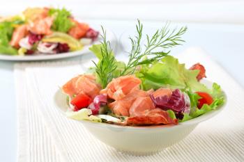 Bowl of green salad with salmon 