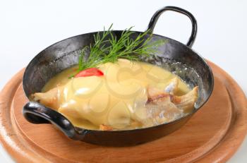 Pan-seared white fish with rich Hollandaise sauce