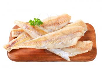 Fresh fish fillets on cutting board