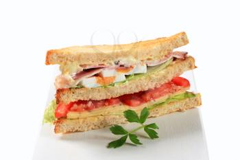 Deli sandwich with ham, cheese, egg and veggies