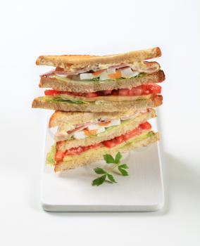 Deli sandwiches with ham, cheese, egg and veggies