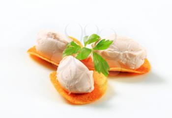 Ham or salmon mousse on spicy crisps