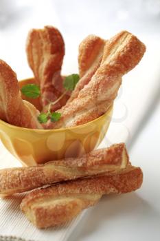 Puff pastry twists sprinkled with sugar 