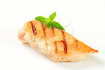 Grilled chicken breast isolated on white