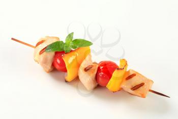 Grilled chicken skewer with yellow pepper and tomatoes