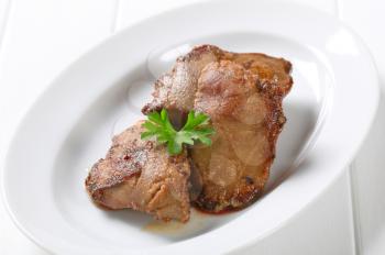 Pan fried chicken liver on plate