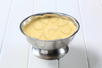 Vanilla custard in a metal serving dish
