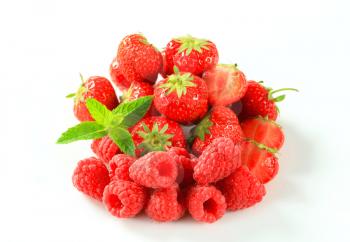 Studio shot of fresh strawberries and raspberries