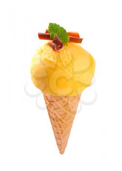 Yellow ice cream cone isolated on white