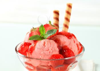 Strawberry ice cream sundae with wafer sticks