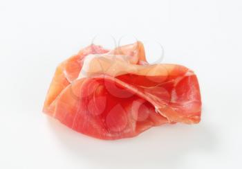 Thin slice of dry cured smoked ham